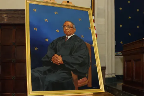 Portrait and judges seated behind the bench
