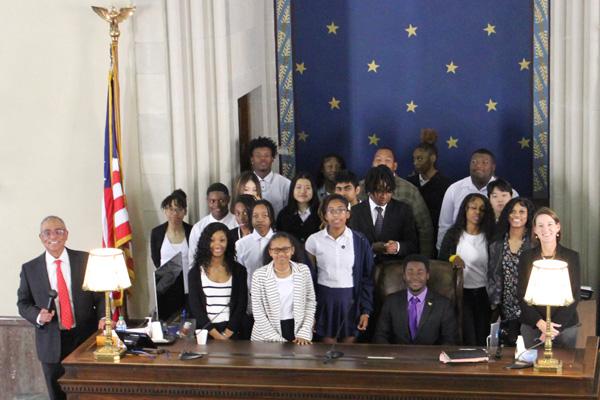 Judges and students photographed behind the bench